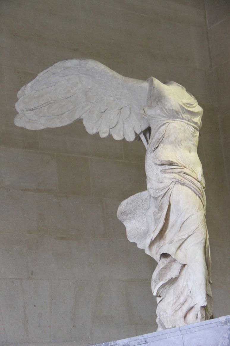 a statue of a headless angel